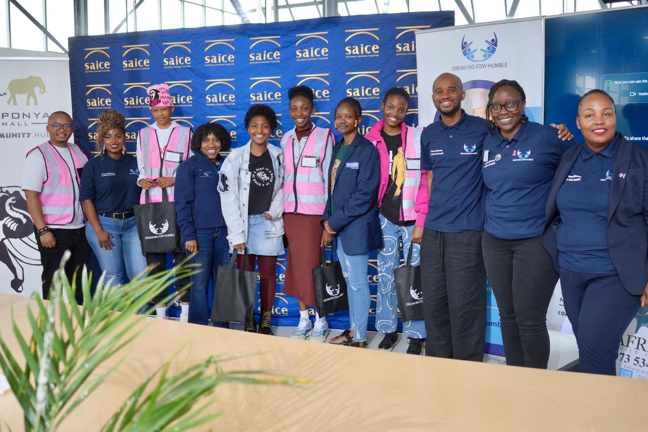 Dream Big Stay Humble team at a community event
